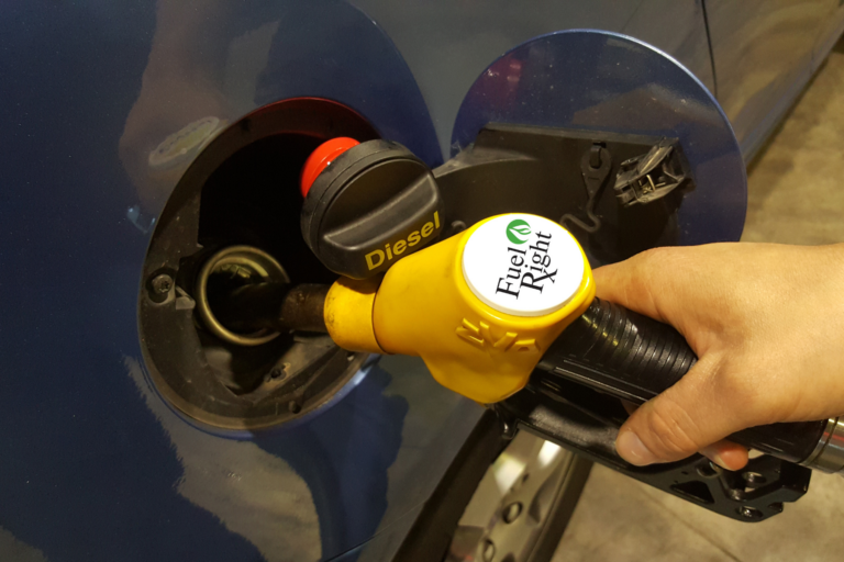 Fuel Right treatment being added to a vehicle fuel tank