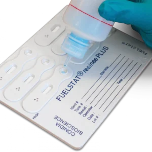 Conidia FUELSTAT Plus microbial fuel testing cassette with reagent being applied to sample well